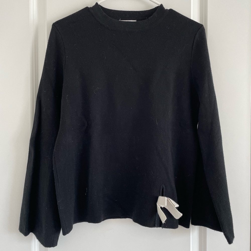 Black sweater with white tie detail
